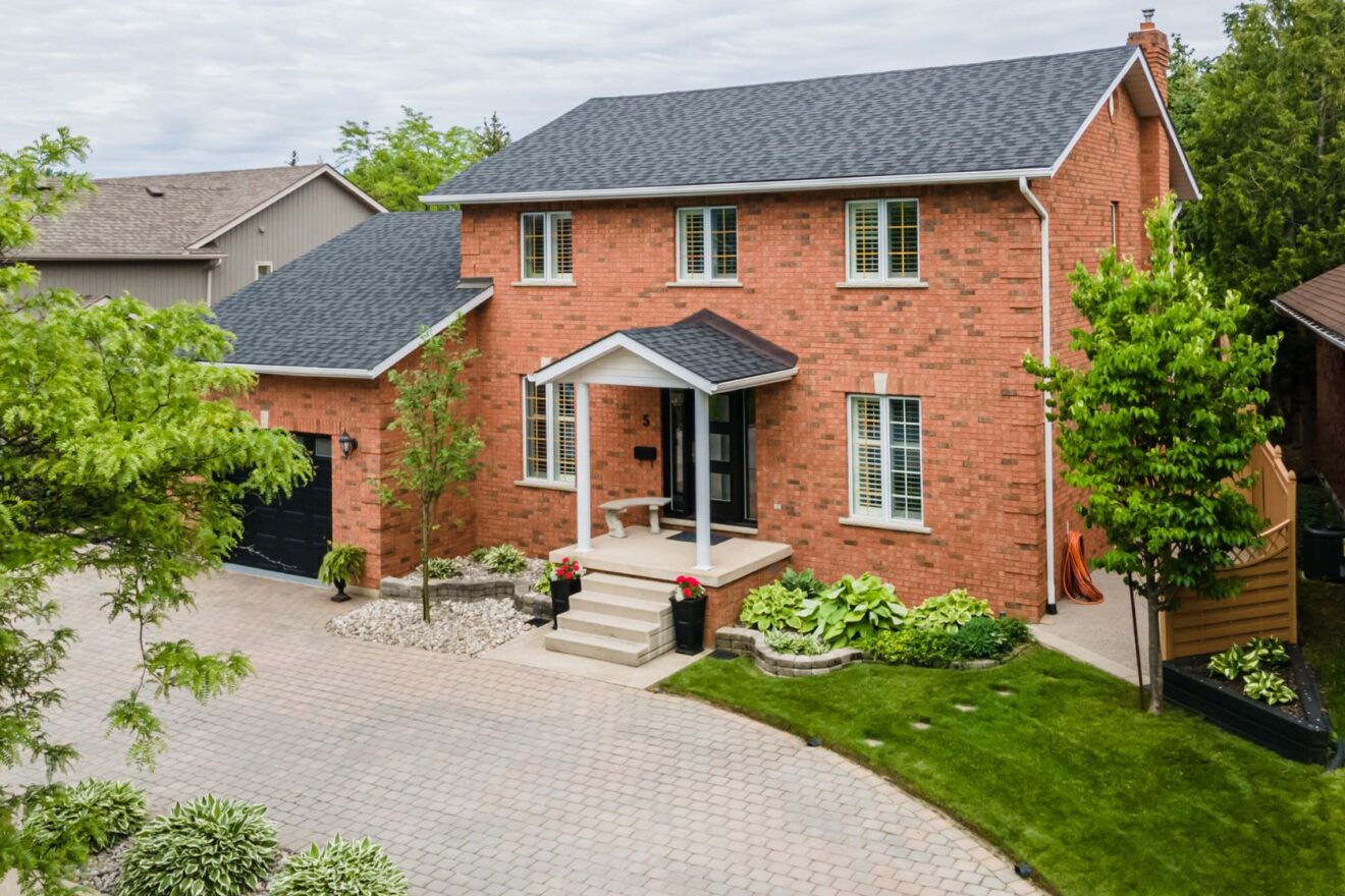 Front red brick exterior of 5 Carmichael Crescent, Collingwood